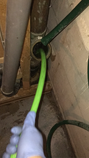 High pressure jetting a grease build up in a kitchen drain 